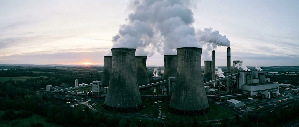 Cooling towers at a coal-fired power station at dawn