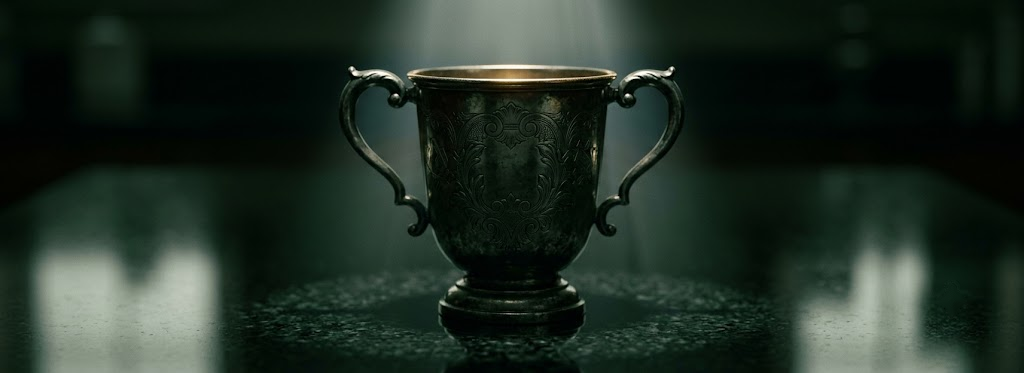 An engraved trophy cup in low light
