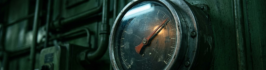An industrial gauge with the needle deep in the upper range