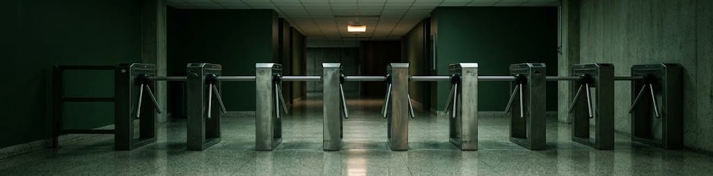 A turnstile in an empty corridor