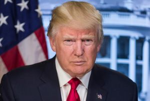 President Donald J Trump in front of a US flag and an image of the White House