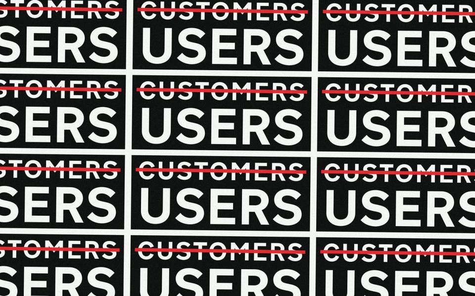 Tessellating GDS stickers crossing out "customers" and with "users" instead