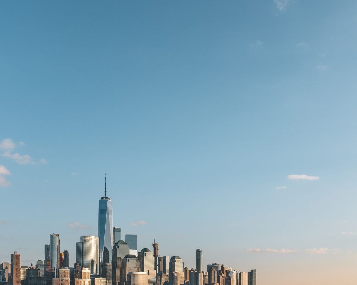 Skyline of downtown Manhattan of New York City, under blue sky, viewed from New Jersey, USA
