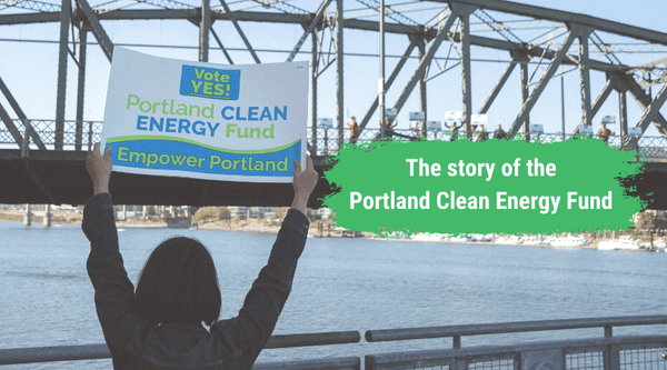 Just Solutions article by Zully Juarez on PCEF featured image of a person holding up a sign that says "Yes! Portland Clean En