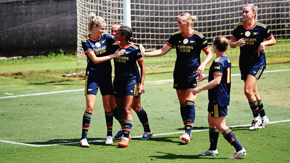 Leah Williamson celebrates scoring vs AC Milan with a headed goal