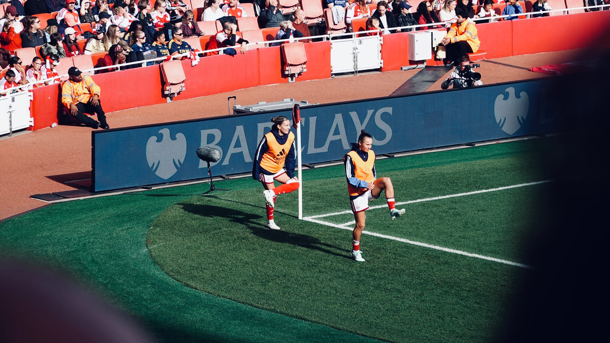Steph Catley and Caitlin Foord warm up at the Emirates Stadium | Photo by Roberto Revilla
