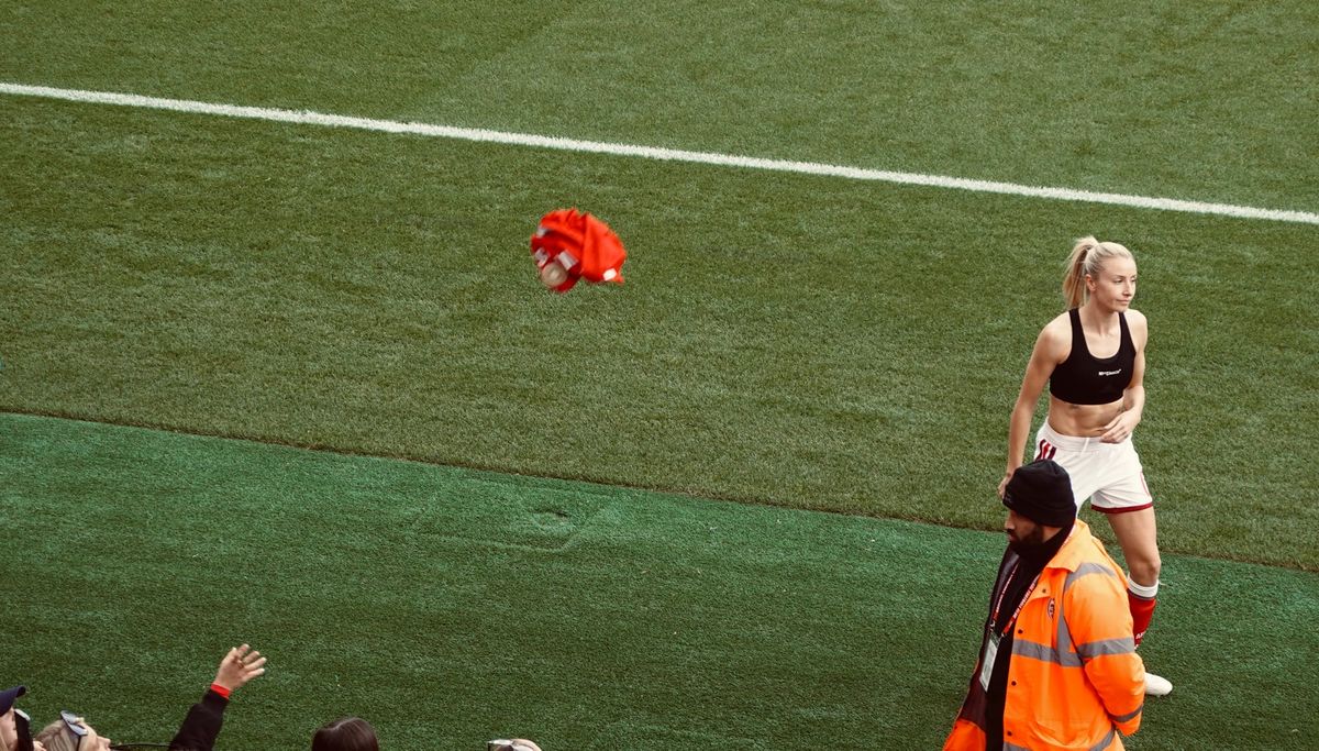 Arsenal Women Vice Captain Leah Williamson throws her shirt towards the crowd expressing her disappointment at the draw with Birmingham City | Photo by Roberto Revilla