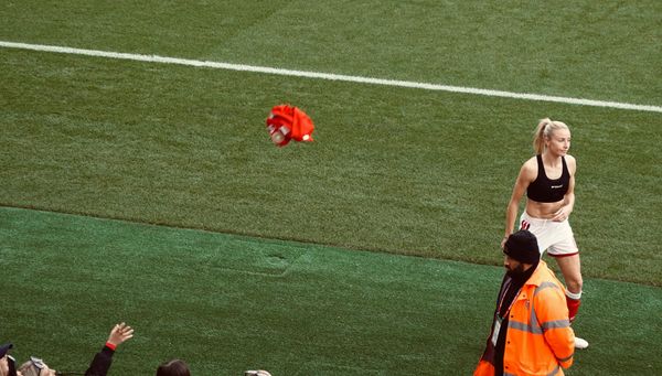 Arsenal Women Vice Captain Leah Williamson throws her shirt towards the crowd expressing her disappointment at the draw with Birmingham City | Photo by Roberto Revilla