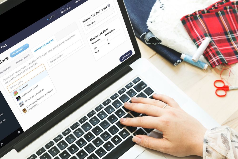 a woman navigating the previous missions on a laptop