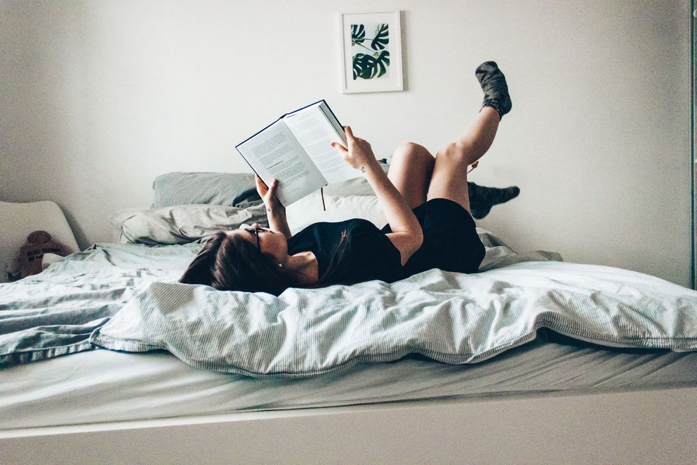 woman reading in bed