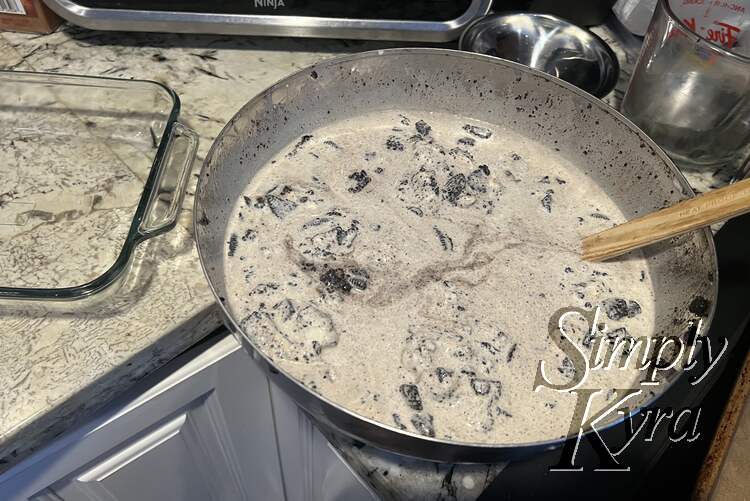 Melting ice cream and Oreo cookies all mixed together.