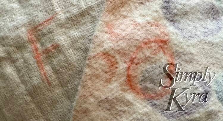 Two skirt pieces overlapped together with one marked with an F and the other with an O (simpler to write than a B).