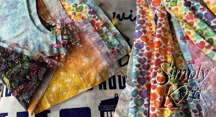 Stack of clipped sleeves and bodices on the left and skirts on the right. 