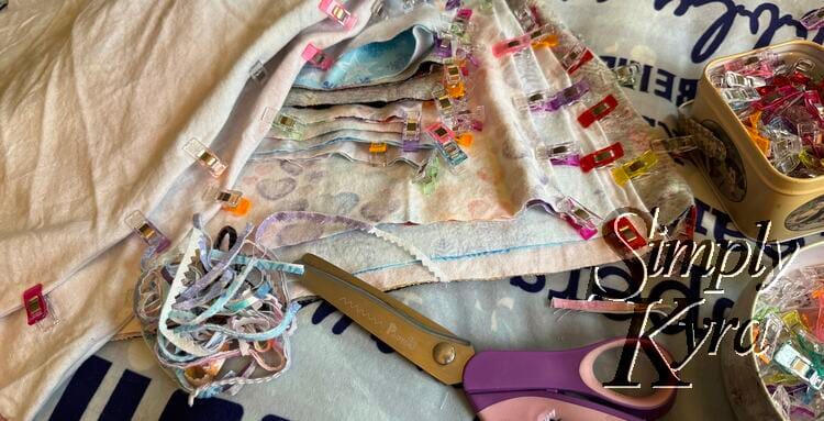 Image shows the right sides together, trimmed, and clipped bodice and skirts. Trimmed pieces are to the left and clipped to the right. 