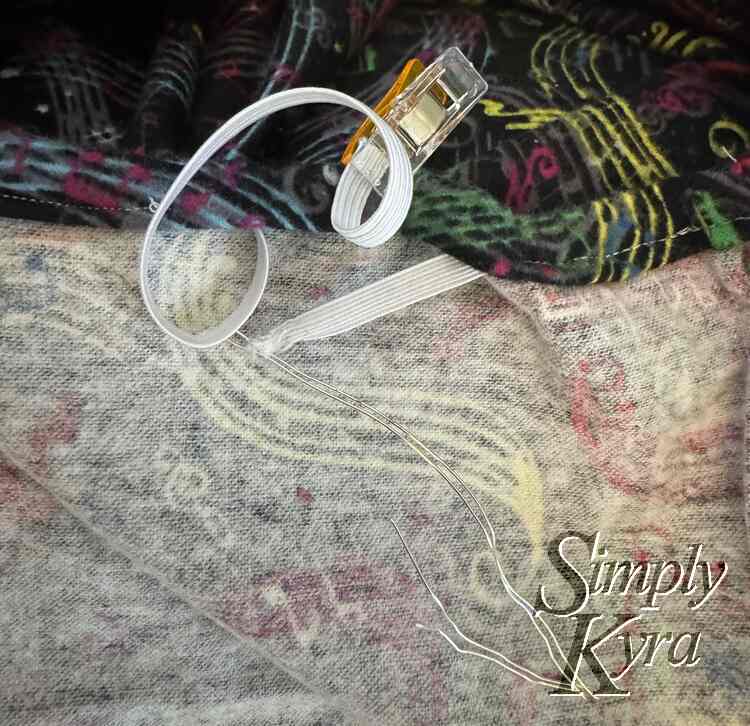 Image shows wire threaded elastic looking a bit sad sticking out of the hole next to the nice looking clipped end. 
