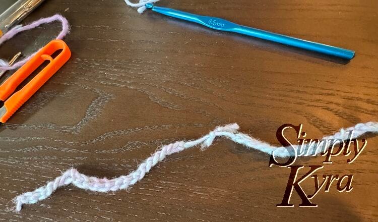 Image shows the two strands knotted together.