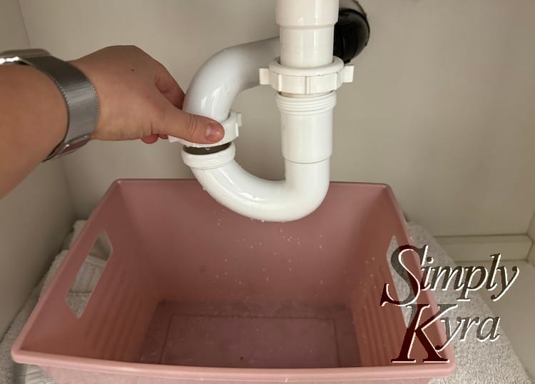 Images shows my hand on the left nut but both loosened enough to see the threaded pipes and space. 