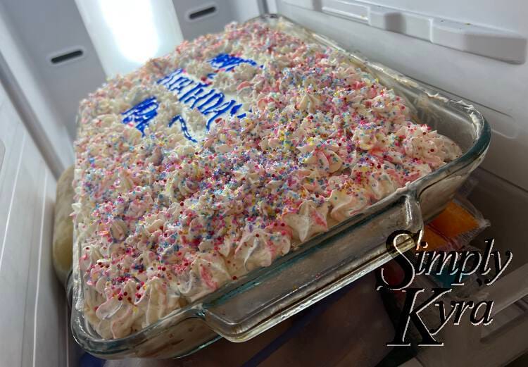 The final ice cream cake carefully written out with "Happy Birthday Ada" and covered in rosettas. 