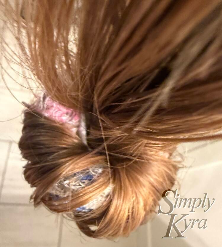 Hair partially in sock dangling. 