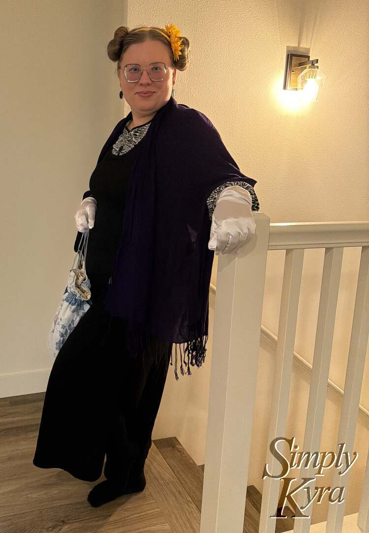 Leaning at the top of the stairs.