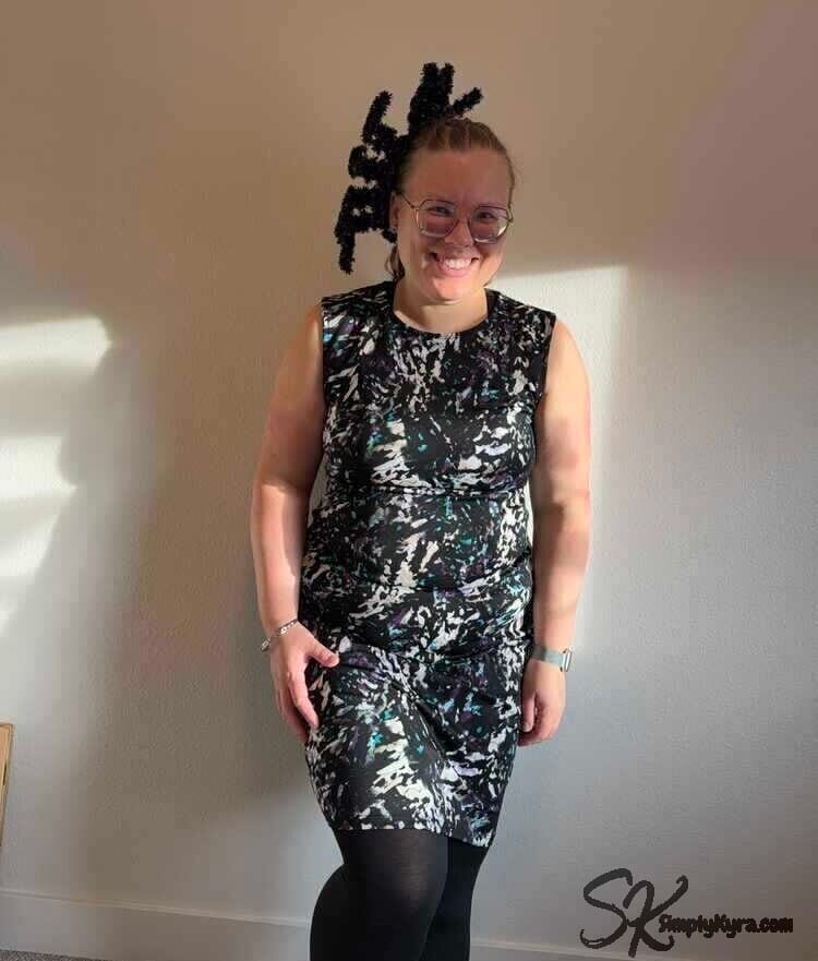 View from the front smiling while the spider peaks over my head. 