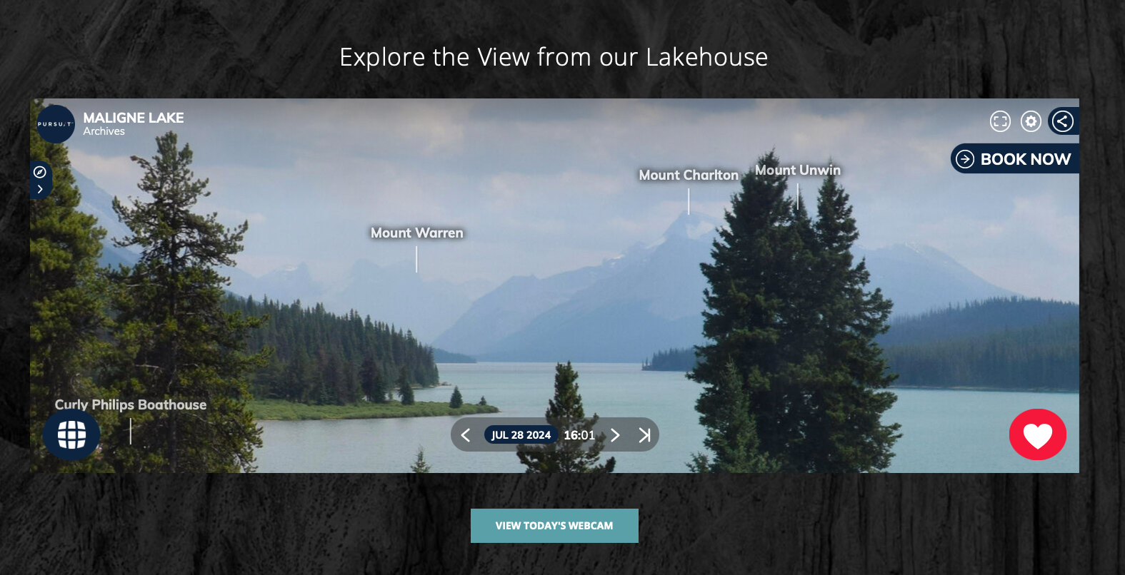 Screenshot showing trees, lake, and labelled mountain peaks in the distance.