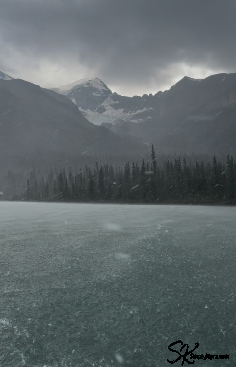 View of the clouds hovering over the darkened mountain with hail in the air and the odd bit obstructing the view on the windows. The water looked pock-marked.