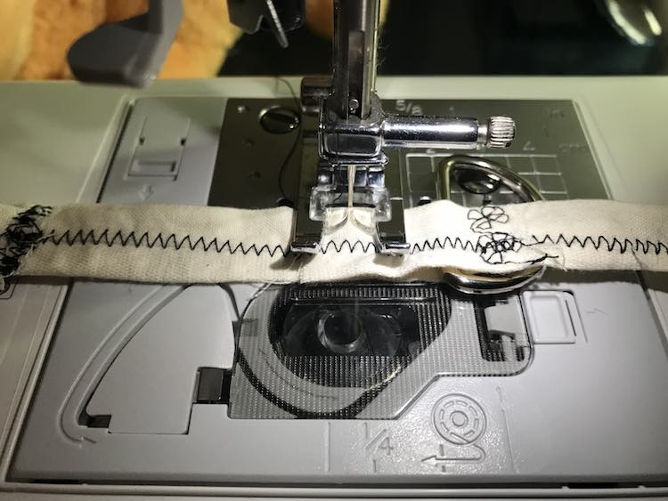 Make sure the D ring is in place before sewing down the other side.