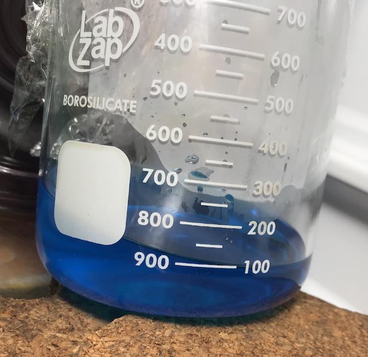 I started out by making blue jello and pouring about half the mixture into the beaker the Jello was going to be served in.