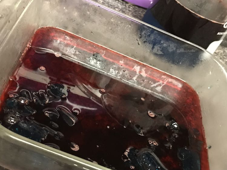 Then poured the excess red Jello into the casserole dish with the broken up blue jello.