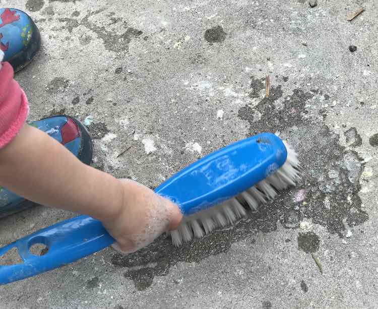 And Zoey was happier washing the cleaner part of the concrete.