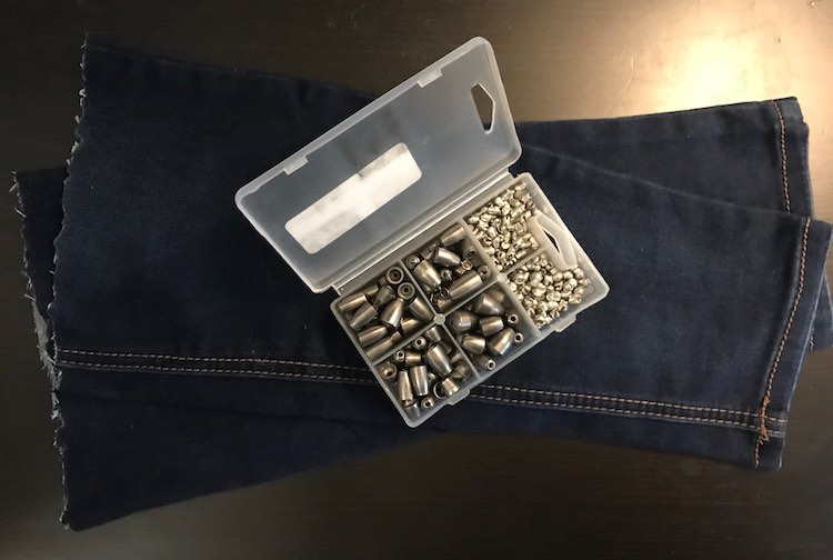 The extra jean fabric I used for the pattern weights with the fishing sinkers laying over top of them.