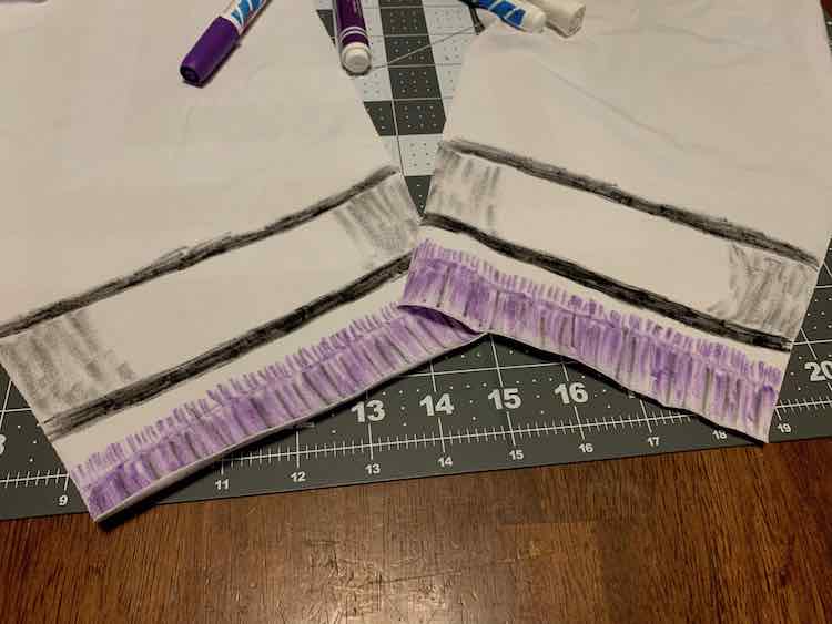 The bottom of the both sleeves are showing. You can see the faux sweater peaking out from under the faux jacket cuff.