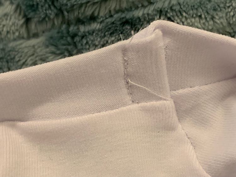 The front side of the tacked down seam.