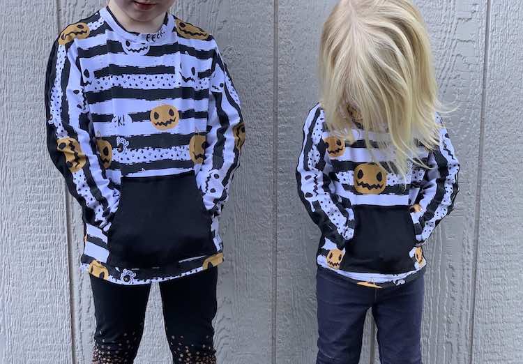 The kids loved discovering their pockets. Front view with both girls hands in their pockets.