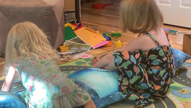 The kids rocking on the pillow.