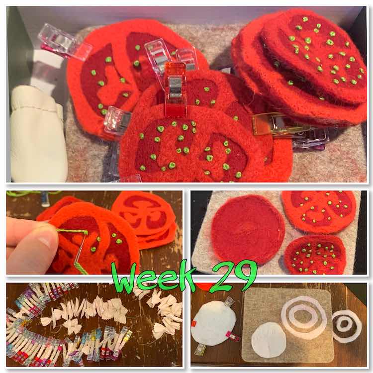 Image is a collage of five photos with a green overlay centered near the bottom saying "week 29". The top image is of clipped together slices of tomatoes laid out over a felting wool board with a thumb cozy by it. The bottom four images are in a grid two by two. The top left image is of my making a green felt knot inside the tomato while the right image shows two tomato tops and one red bottom showing where the needle had poked through. The bottom two images don't contain felt tomatoes. Instead the left image shows a batch of felt pasta clipped and sewn while the right image shows felt onion rings being made.