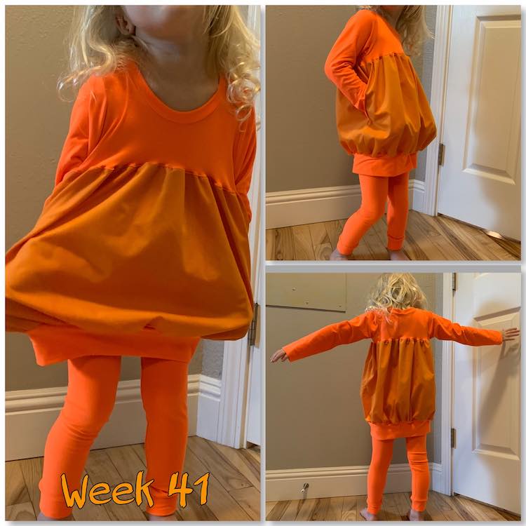 Image is again a collage of three photos. This time the large image is on the left and the two smaller ones on the right. From left, across, and down it shows the outfit pulled out at the sides as Zoey's hands are in the pockets, then an angled one with her hands in the pockets again, and finally a back view with her arms outstretched. At the bottom on the left is says "week 41" in orange.