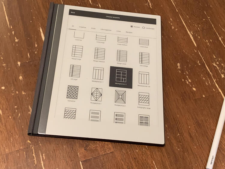 Image shows the reMarkable2 with the pen set aside. On it you can see many of the templates listed with image snapshots above them. The "weeklyplanner 2" is selected.