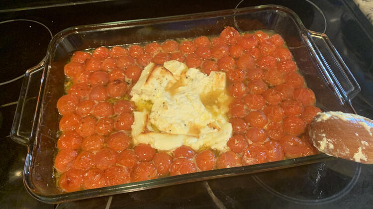 After baking there's more liquid, the feta is browned, and the cherries have popped.