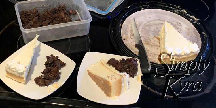 Image shows a mostly gone platter of cheesecake with a knife, two square saucers with a slice each and a pile of brownie bits, and a container of brownies.
