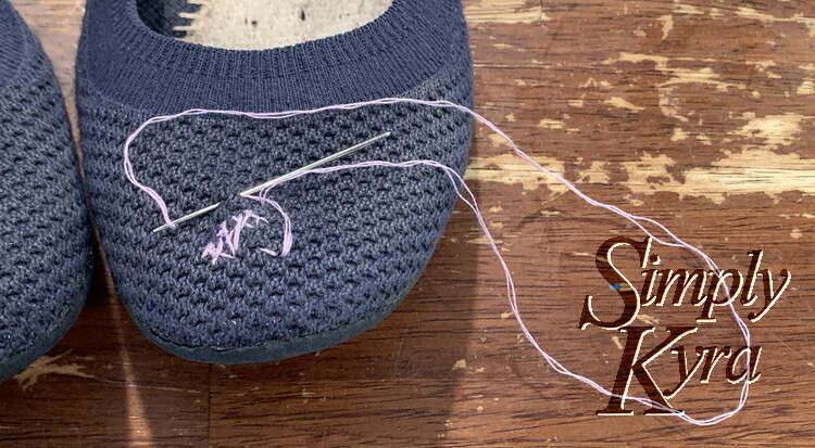 Image is a closeup of the first flat with an outline halfway through being stitched.