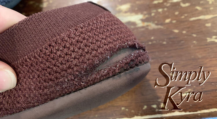 Image shows the back of the shoe with a cut in it that I don't remember happening.