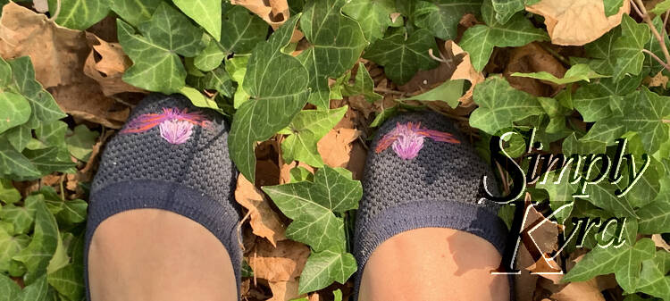 Image shows the flats taken from above looking down at them against greenery and dead yellowed leaves.