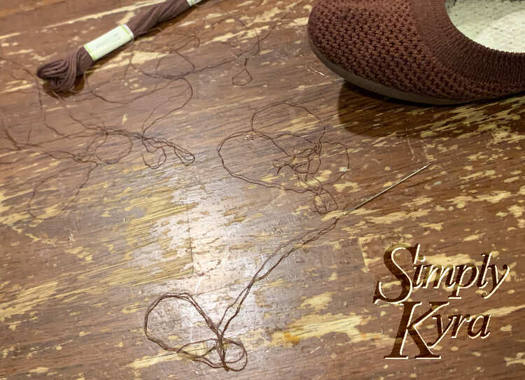 Image shows the thread and embroidery floss on the table next to my flat.