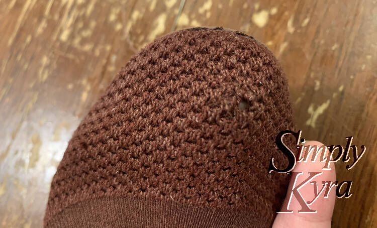 Image shows the front of my flat with my finger inside the shoe helping highlight where the hole is.