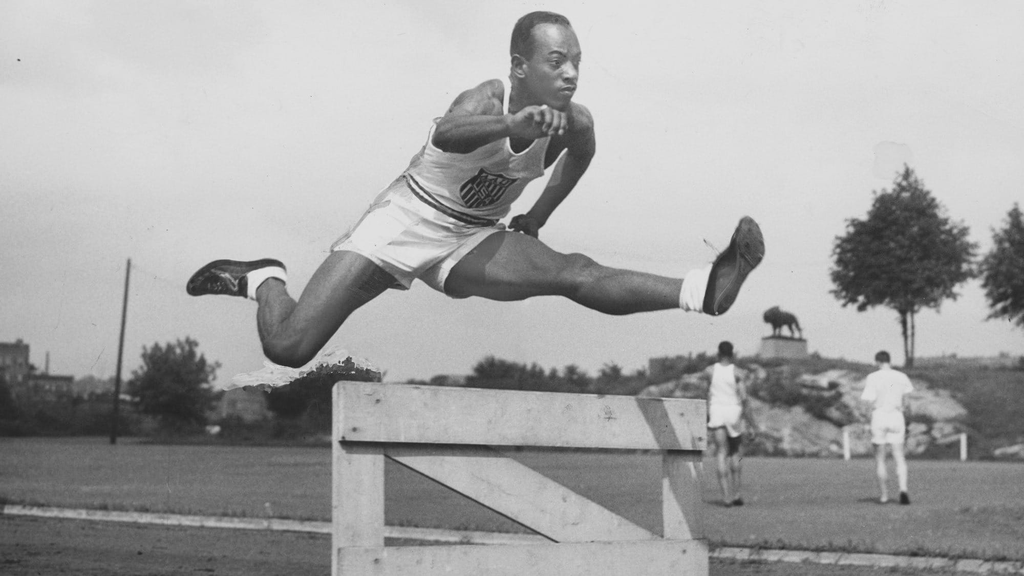 Harrison Dillard, world record holder, jumping a hurdle.