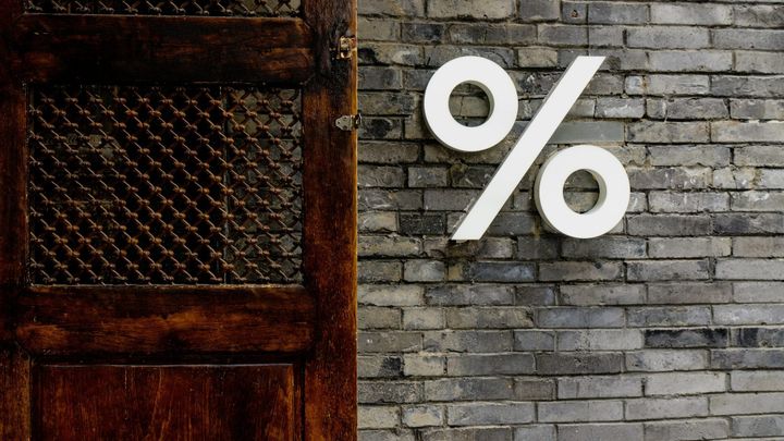 How do interest rate changes affect business value?
