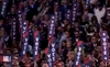 Screenshot of people holding up signs that say "VOTE"