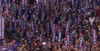 People holding signs that say "VOTE"